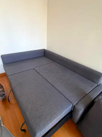 Grey L-shaped sofa bed, converts to large bedwith topper too