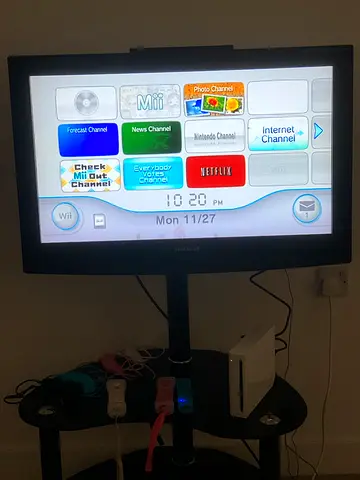 Nintendo Wii console with sensor bar and controllers - working