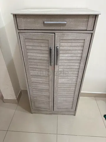 Small wooden shoe cabinet with two tambour-style doors - light oak