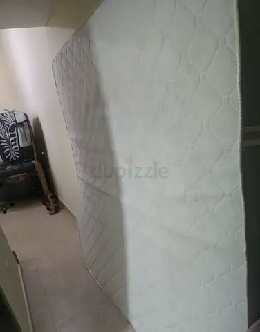 Used queen-size mattress in good condition - firm support