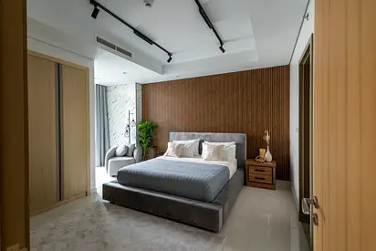Modern upholstered king bed with bedside tables and headboard