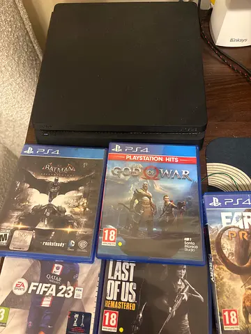 Sony PlayStation 4 Slim Console with 5 Games