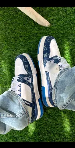Mens designer-style blue and white sneakers, size unknown - lightly used