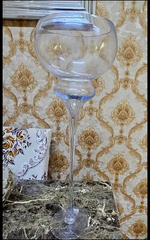 Tall clear glass decorative vase/candle holder on stem