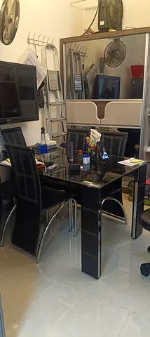Black glass-top dining table with 6 leather chairs - used, good condition
