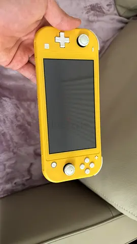 Yellow Nintendo Switch Lite handheld console - good working condition