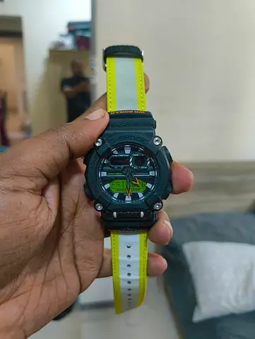 G-Shock style men’s sports watch with black case and yellow strap