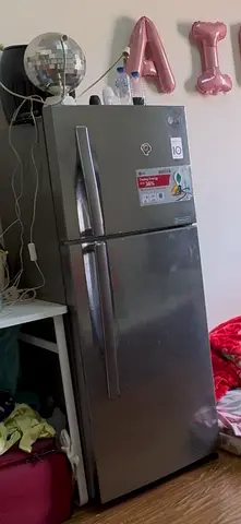 Used silver top-freezer refrigerator - good working condition