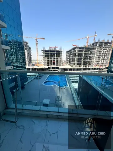 **2 master bedrooms, extra-large hall, 2 balconies, built-in wardrobes, central AC, free parking, gym, pool, prime location near Dubai & Sharjah, flex