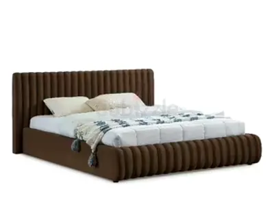 Modern brown upholstered king-size bed with padded headboard