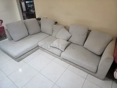Light grey L-shaped fabric sofa - 4-seater, good condition