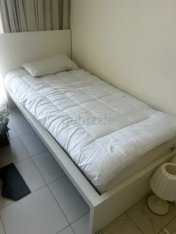 Single white bed frame with mattress