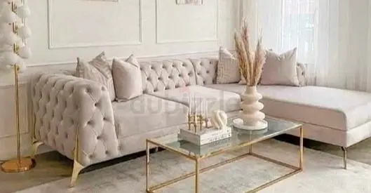 Light beige tufted L-shape sectional sofa with chaise