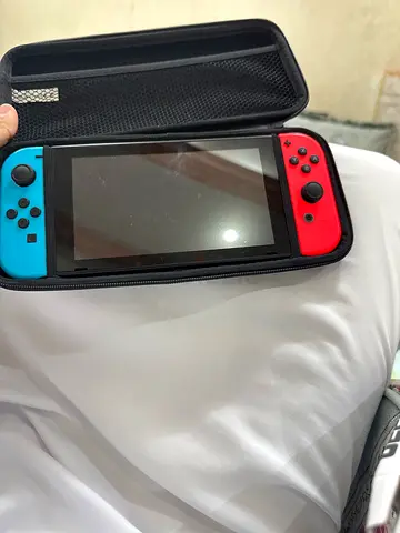 Nintendo Switch Console with Neon Joy-Con and Carry Case