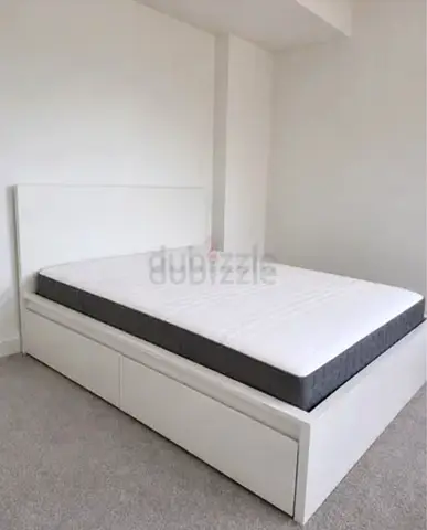 ikea malm king bed with ikea firm mattress   having 2 storage units under the bed