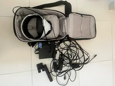 Used VR headset with controllers and cables — good condition