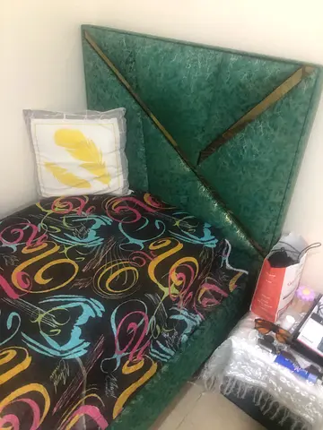 Queen size bed with upholstered headboard and mattress (used)