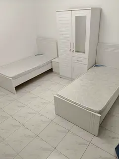 Bed space in room with balcony Aspin Tower