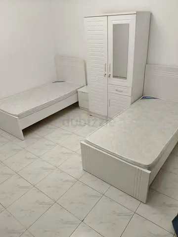 Bed space in room with balcony Aspin Tower