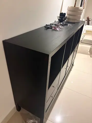 Black low shelving unit / TV stand with storage cubbies