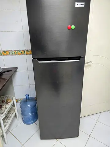 Silver double-door fridge in good working condition