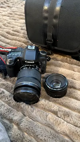 Canon DSLR with 18-55mm kit lens, extra 50mm lens and bag - good condition