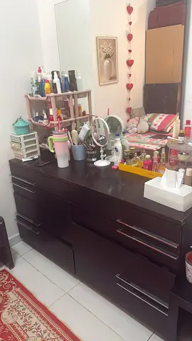 Dark wood dresser with mirror and multiple drawers - good condition