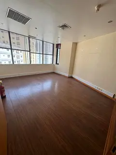 Office for annual rent in Al Majaz 1. Free air conditioning with 6 partitioned rooms. Includes 6 mon