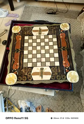 Vintage-style wooden chess set with Egyptian design, foldable velvet lined storage board