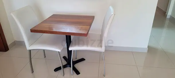 Compact wooden dining table with 2 modern white chairs - good condition