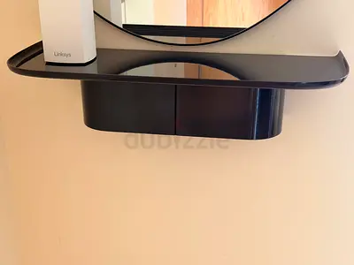 Wall-mounted black floating shelf from HAY