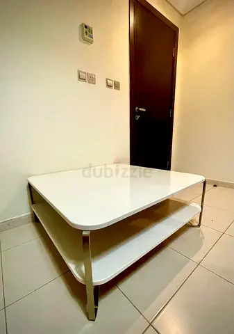 White modern rectangular coffee table with lower shelf
