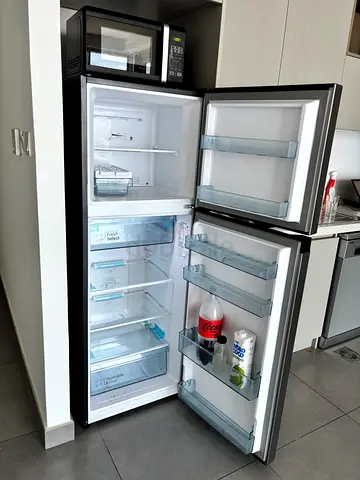 Used double-door refrigerator with freezer - good working condition