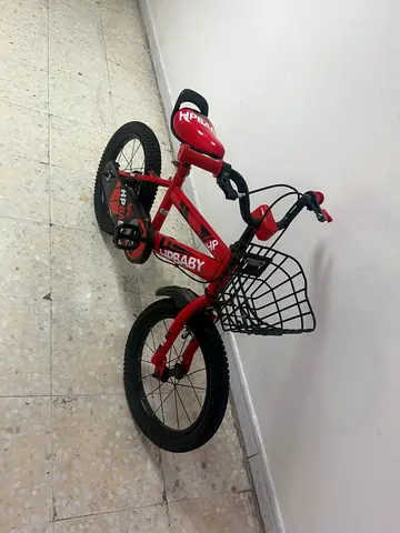 Red kids bicycle with front basket, 16-inch wheels