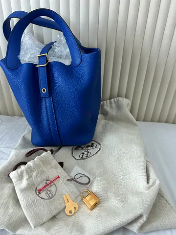 Hermès Picotin Lock 18 bag is crafted from Bleu Royal Clemence leather