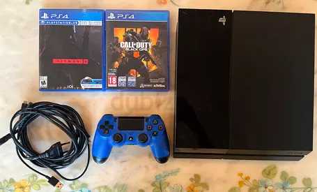 Sony PS4 console with DualShock controller, 2 free games and cables (working)