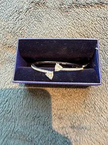 Silver-tone bangle bracelet with heart crystal accents (like-new)