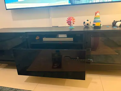 Black gloss TV entertainment unit with storage - good condition