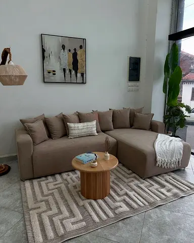 L-shaped beige fabric sofa with chaise - good condition
