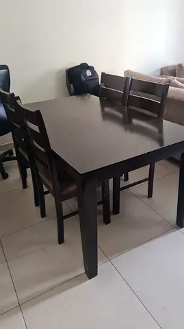 Brown Wooden Table with Four chairs