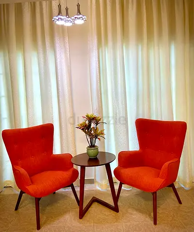 Pair of Orange Mid-Century Modern Accent Chairs with Side Table and Vase
