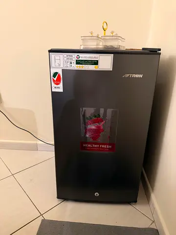 single-door mini fridge —very good working condition 4 months used with 1 year safari warranty