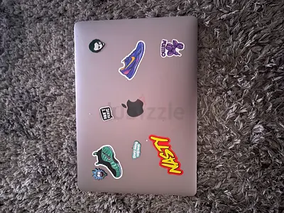 Used MacBook Pro 13-inch with stickers - Good working condition