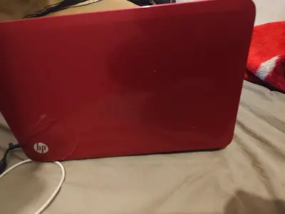 Red HP Laptop - Working Condition, Minor Scratches