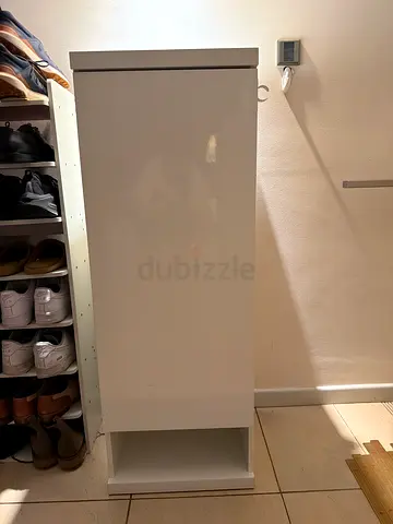 Slim white shoe cabinet with open shelf - compact storage