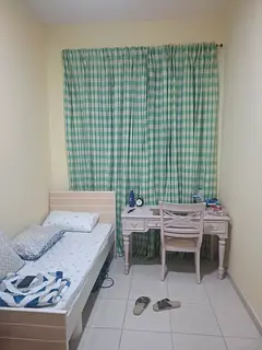 Bedspace available in a clean room with attached bathroom, suitable for a working professional