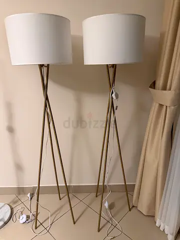 Pair of modern tripod floor lamps with white drum shades
