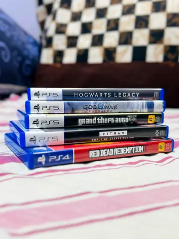 Bundle of Five PS5/PS4 games - Hogwarts Legacy, $% of War, GTA V, Hitman, Red Dead Redemption 2
