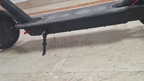 Electric scooter in working condition — sturdy deck and kickstand