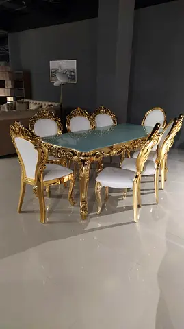 Ornate Gold 8-Seater Dining Table with Glass Top and Upholstered Chairs